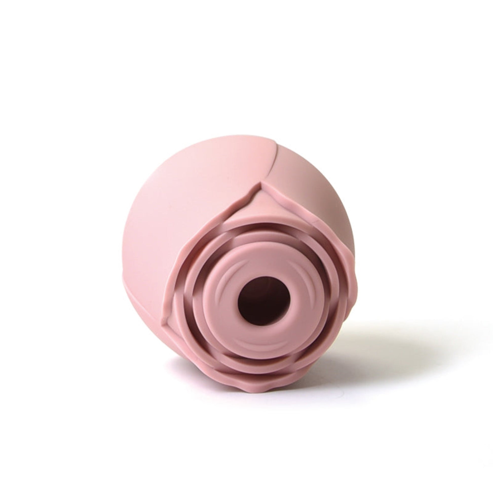 rose clitoral vibrator lying on side