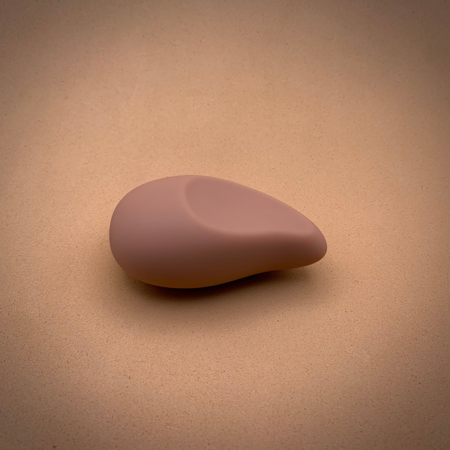 a pebble shaped, nude coloured vibrator