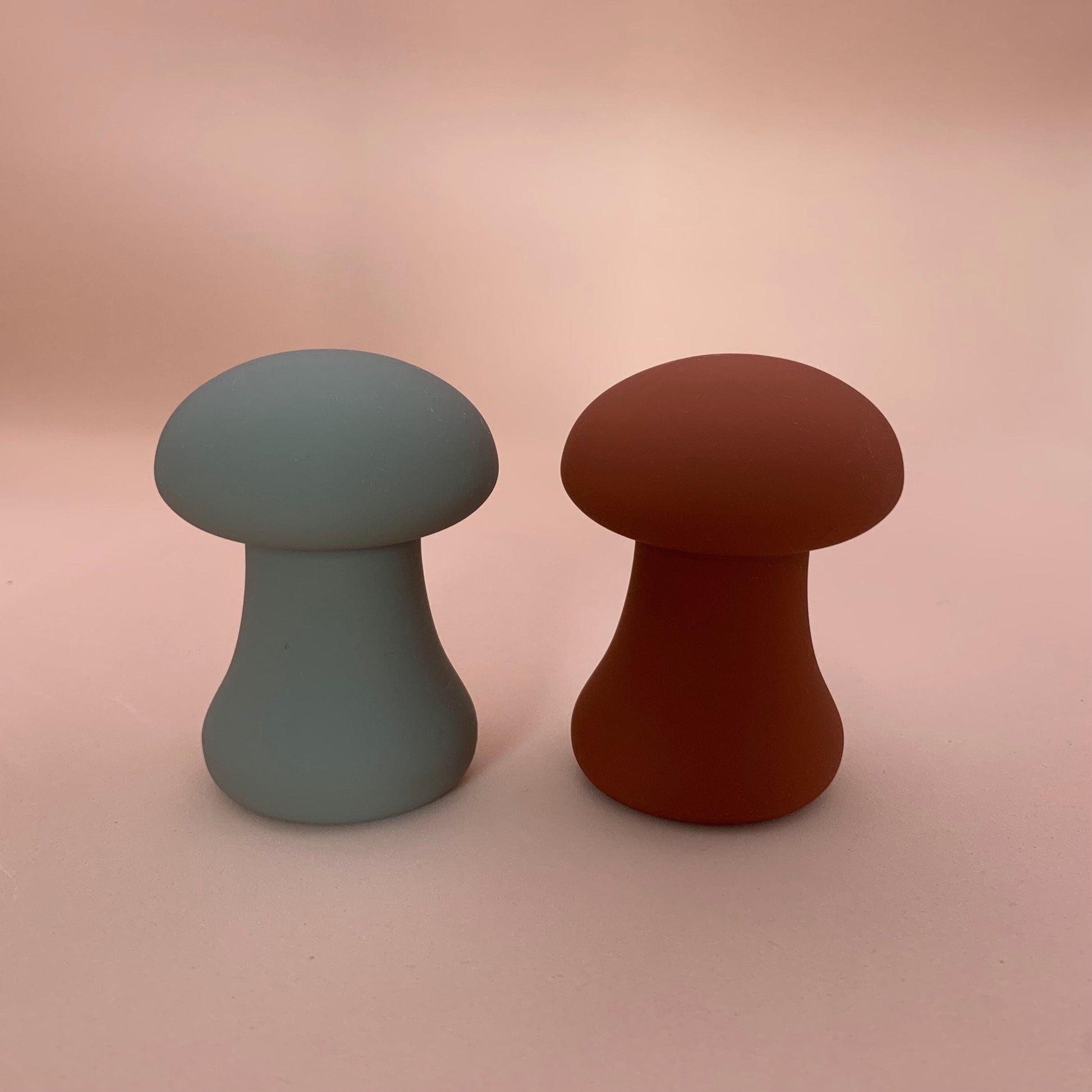 two mushroom shaped clitoral mini vibrators standing side by side